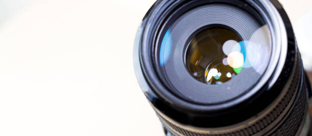 istock Camera lens with bokeh lights background, banner for website 983995090