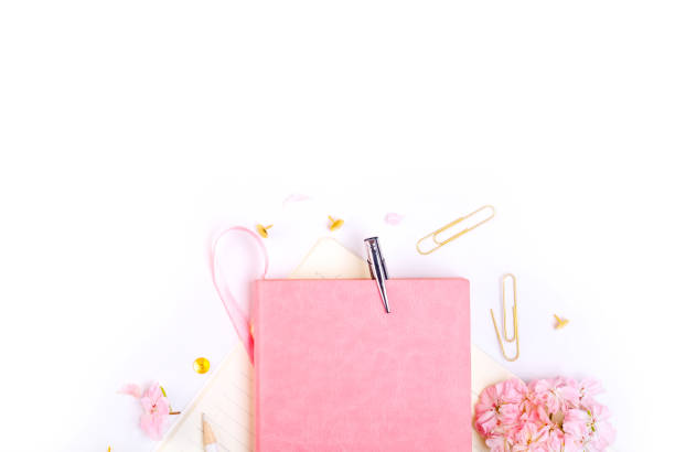 istock Workplace mockup with pink leather notebook, glasses and golden accessories top view. Flat lay with copy space.  Feminine working style concept. 983996048