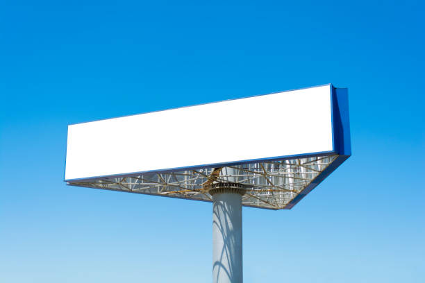 istock Blank big billboard over blue sky background, put your text here 984003606