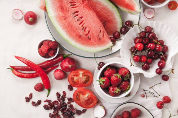 istock Red fruit and vegetable composition on linen fabric. Summer natural beauty concept with copy space. 984011482