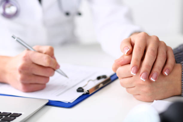 istock Friendly female doctor hold patient hand 984018766