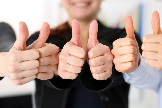 istock Group of people show OK or confirm with thumb up 984019322