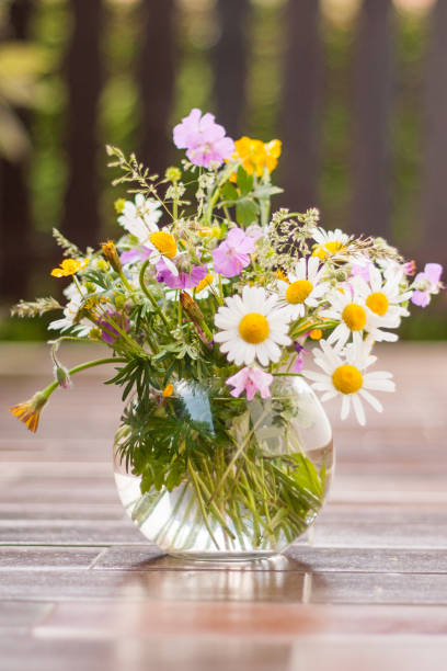 istock Wild flowers in a glass 984019680