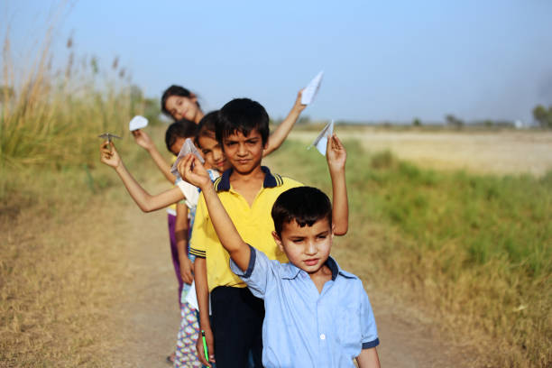 Group of rural children playing outdoor in the nature.
