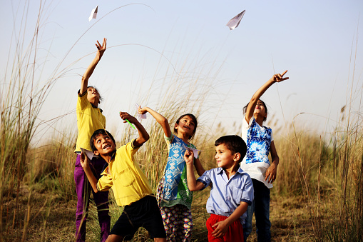Group of rural children playing outdoor in the nature.