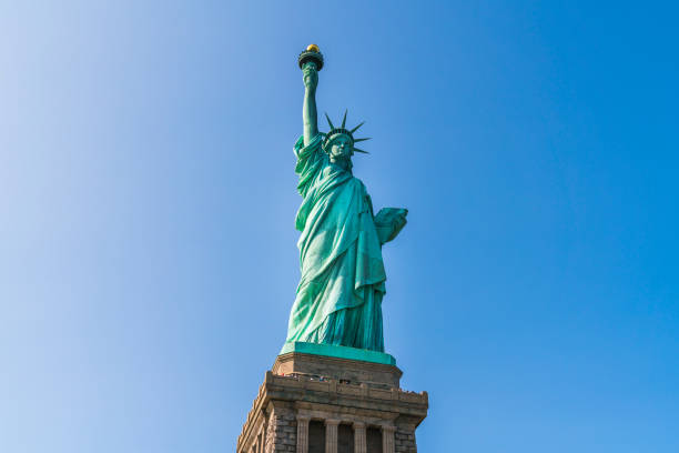 istock The statue of Liberty  with blue sky background. 984023992