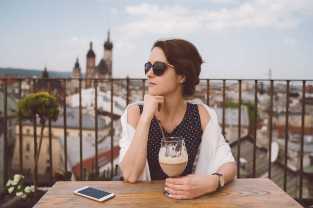 istock Woman in restaurant eating dessert 984026074