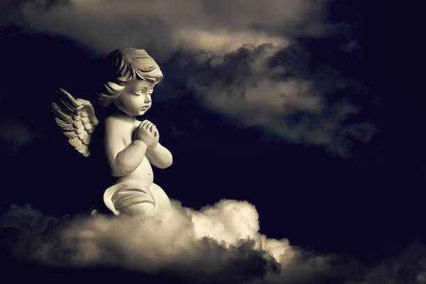 istock Angel guardian on the cloud 984028496