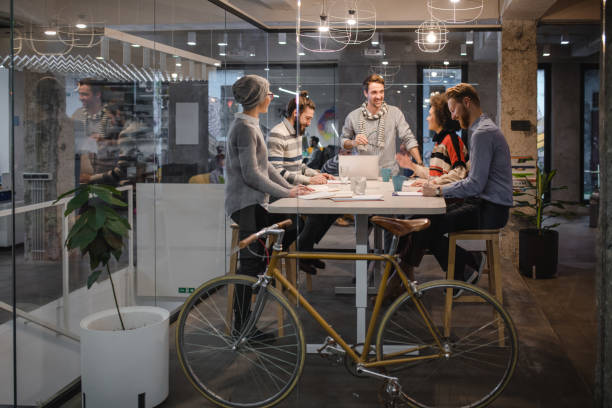 istock Happy business colleagues talking while working in the office. 984028706