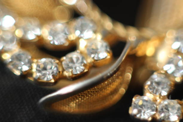 istock Golden jewelry with gemstones in macro 984032854