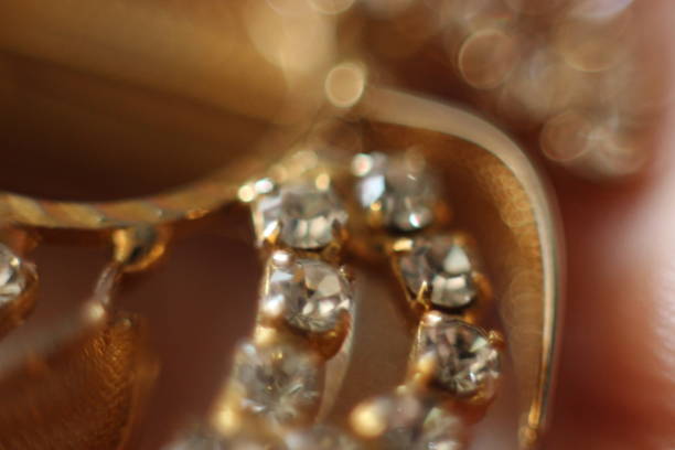 istock Golden jewelry with gemstones in macro 984032948