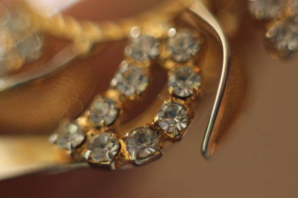 istock Golden jewelry with gemstones in macro 984033020