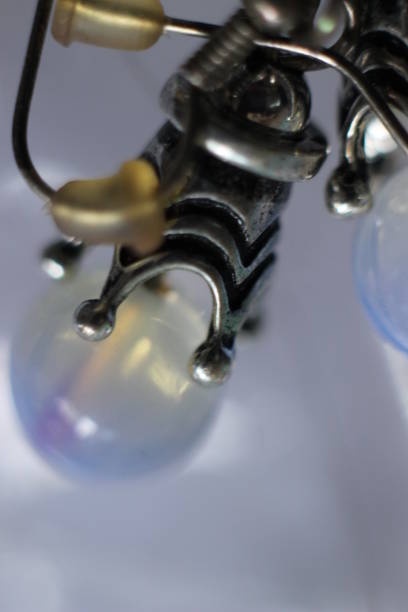 istock Silver earrings with glass stone in macro 984035884