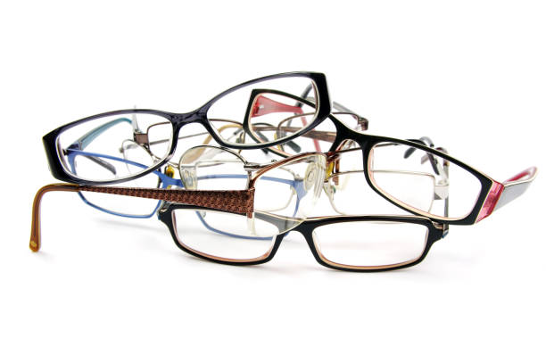 istock used reading glasses on a white background 984039524