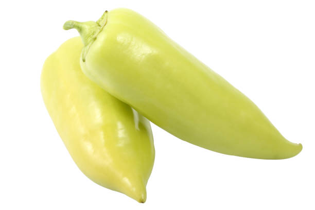 Two ripe banana pepper (also known as the yellow wax pepper) isolated on a white