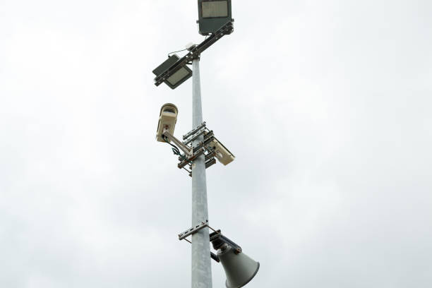 istock Security CCTV cameras and loudspeaker mounted on the post for street surveillance. 984042372