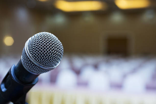 istock Close up. Microphone in conference hall. Business meeting. Microphone Training. 984042652