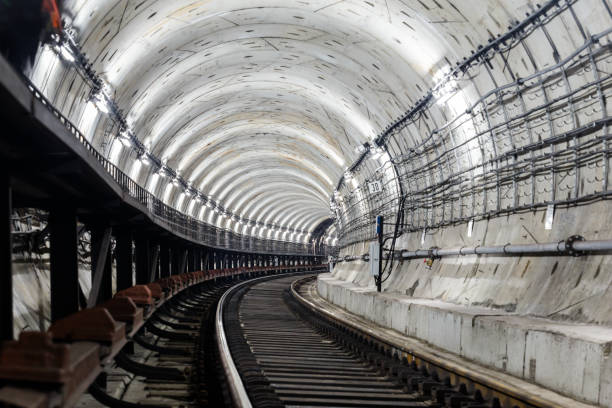 istock circular tunnel subway rails and sleepers turns right and is illuminated with white light 984050116