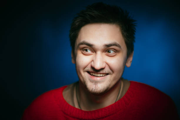 istock emotional young man photo in studio 984050280