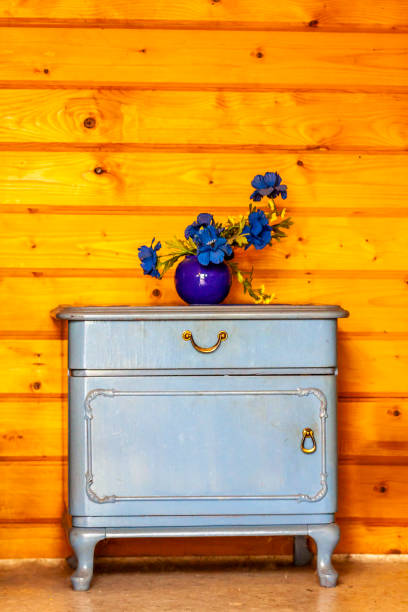 istock Ancient blue drawers placed in front of wooden wall 984050282