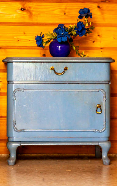 istock Ancient blue drawers placed in front of wooden wall 984050528