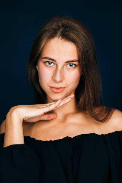istock Portrait beautiful girl on a dark studio background 984054326