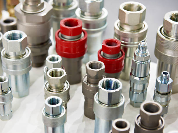 Hydraulic quick couplers Hydraulic quick couplers in store hose stock pictures, royalty-free photos & images