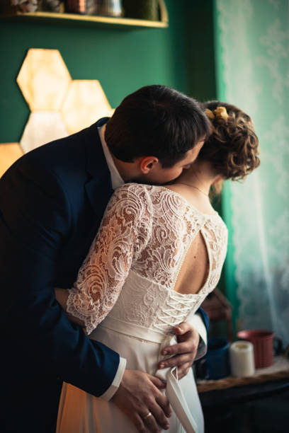 istock couple groom and bride in light studio 984071424