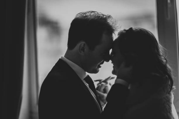 istock young bride and groom couple in a bright studio photo 984073494