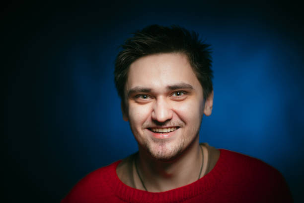 istock emotional young man photo in studio 984074176