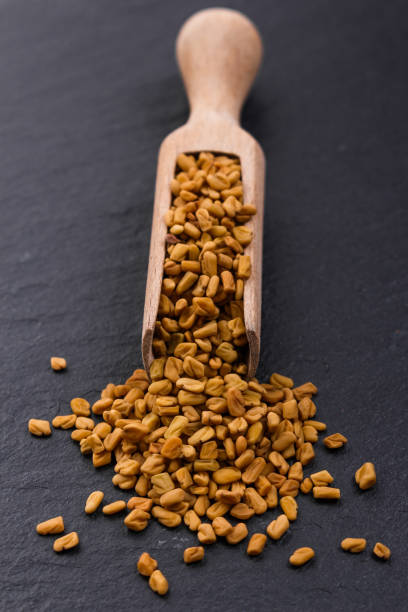 istock fragrant grains of fenugreek on a rustic background 984074748