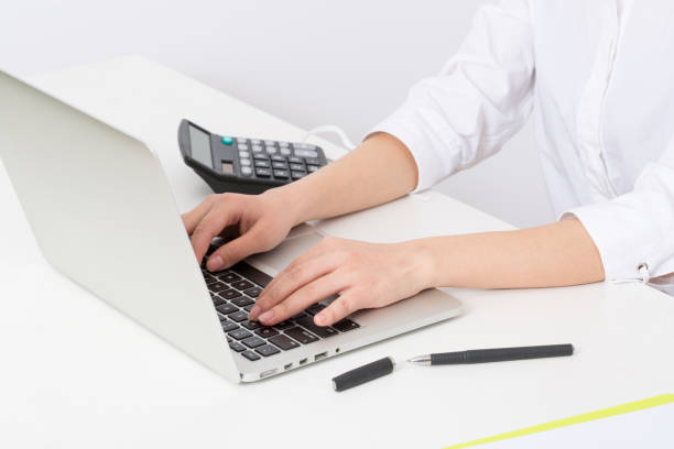 istock Closeup of young woman typing on laptop computer 984078962
