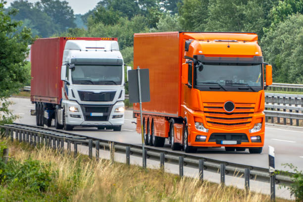 Two modern Trucks close up: Transport on the highway