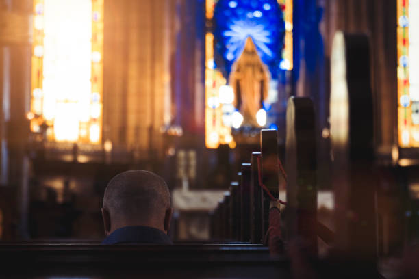 istock Man Praying in Church 984093914