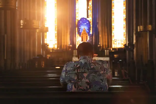 Man Praying in Church