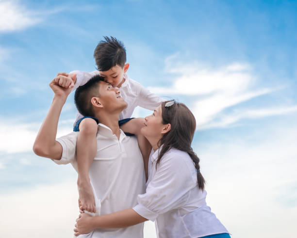 portrait happy family mom dad and son playing together stock photo