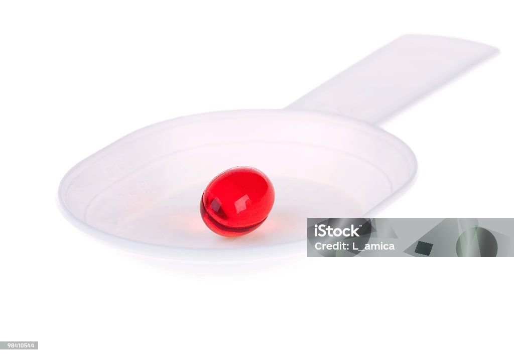 Rote Kapsel auf einem weißen Kunststoff-spoon - Lizenzfrei Antibiotikum Stock-Foto