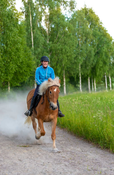 istock Woman horseback riding 984106620
