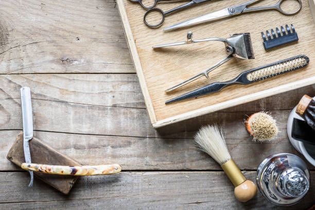 istock Old vintage barbershop tools on wooden table 984106642