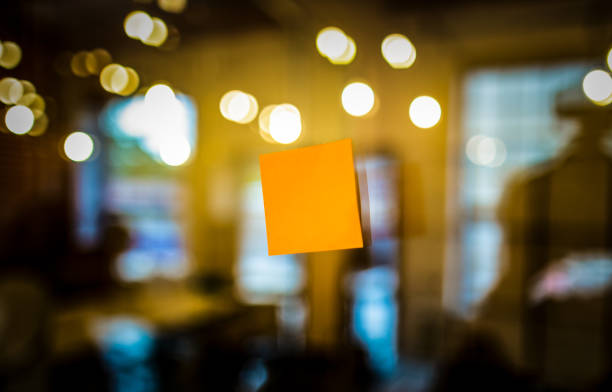 istock Self adhesive note stuck on the glass. 984117254
