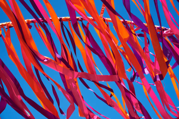 istock Multicolored ribbons flying in windy weather. Background 984120114