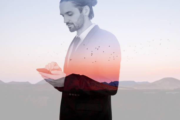 istock Double exposure with businessman and landscape view 984125088
