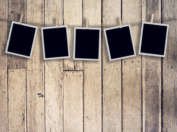 istock Five instant photo on Wood Background and Texture vertical, Vintage toned. 984125548