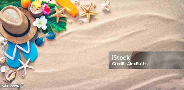 Straw Hat With A Exotic Cocktail And Sunglasses On Sand Beach Stock Photo - Download Image Now