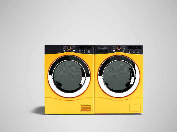 istock Modern orange two washing machines for large family 3d render on gray background with shadow 984133904