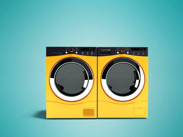 istock Modern orange two washing machines for large family 3d render on blue background with shadow 984133982