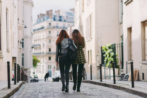 istock Two friends walking in the city 984134870