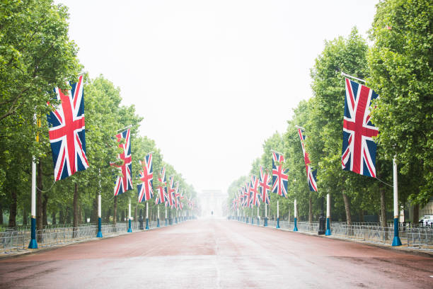 The Mall decorated with Union Jack flags London UK The Mall decorated with Union Jack flags London UK buckingham palace photos stock pictures, royalty-free photos & images