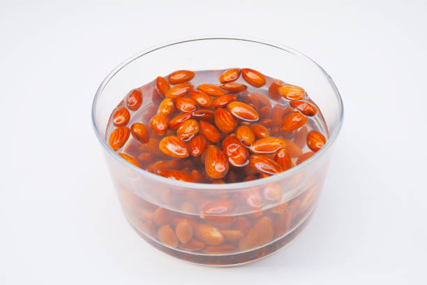 Soak the almonds in a bowl to make almond milk. stock photo