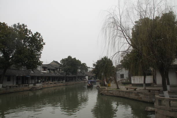 istock Beautiful Chinese city with canal bridge and tree 984172574